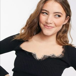 ASOS design sweater with notch neck and lace detail in black.